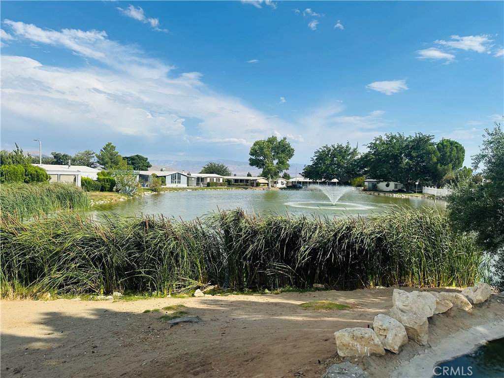 20683 Waalew Road, Unit B145 Apple Valley, CA 92307 - Photo 22 of 32 a view of a lake with houses in the back