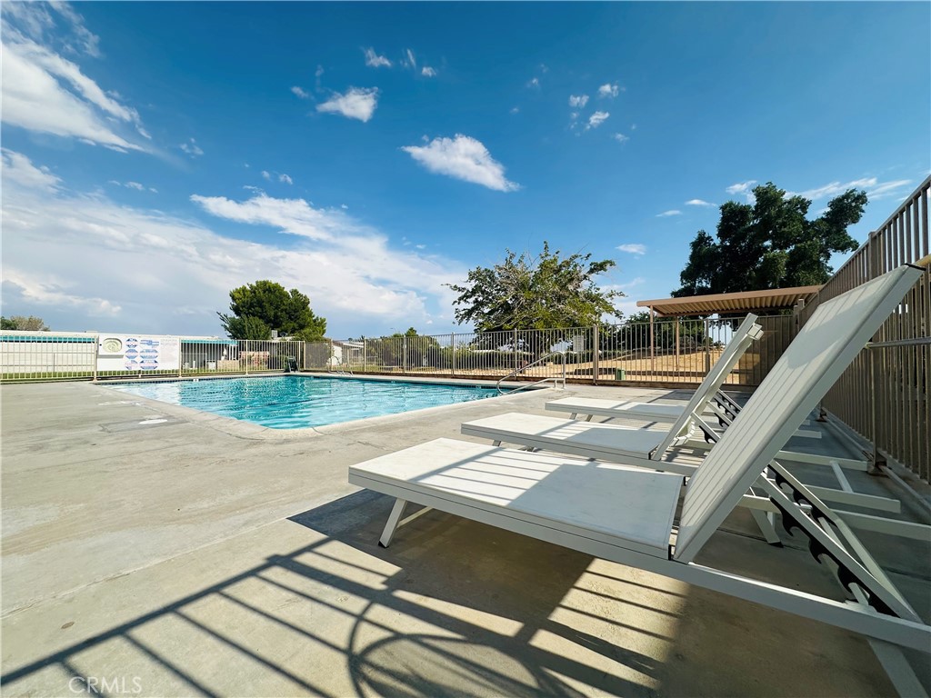 20683 Waalew Road, Unit B145 Apple Valley, CA 92307 - Photo 25 of 32 a view of swimming pool with outdoor seating and plants