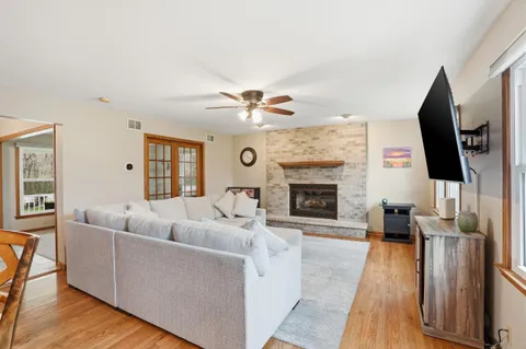 a bathroom with a granite countertop sink and mirror