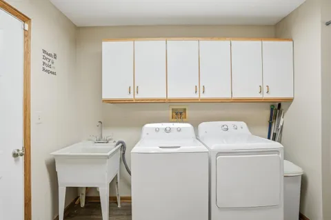 a spacious bedroom with a bed and window