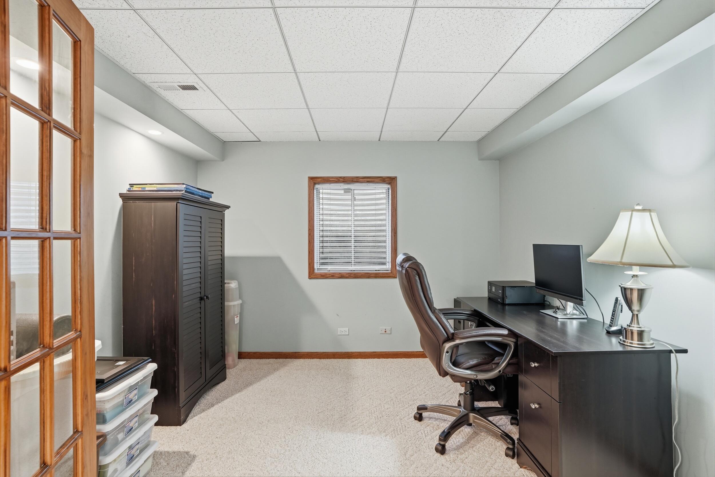 1122 Douglas Lane Crete, IL 60417 - Photo 22 of 28 a view of a workspace with furniture and a window