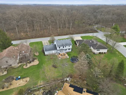 an aerial view of a house having yard