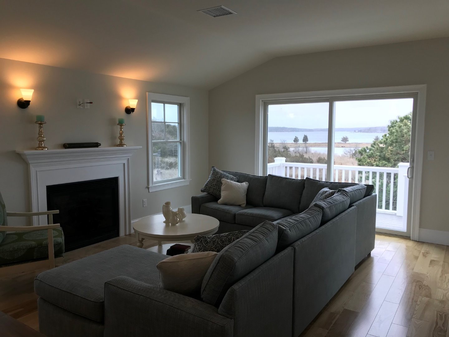28 Beach Road Oak Bluffs, MA 02557 - Photo 15 of 32 a living room with furniture and a fireplace