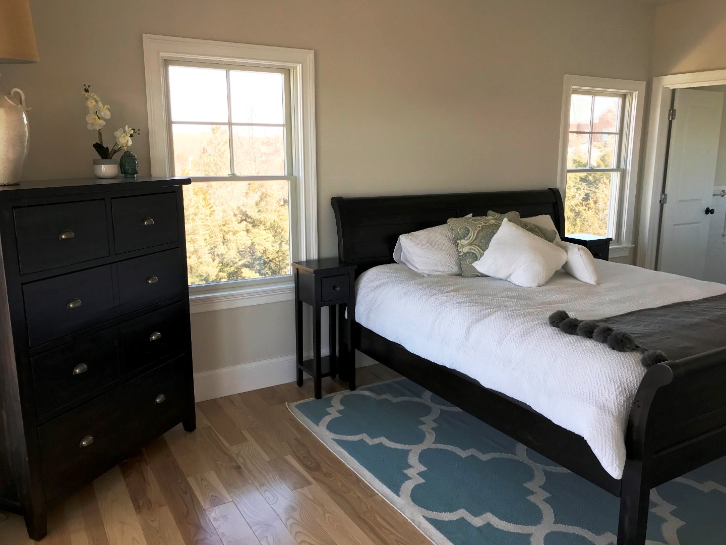 28 Beach Road Oak Bluffs, MA 02557 - Photo 19 of 32 a bedroom with a bed and a window