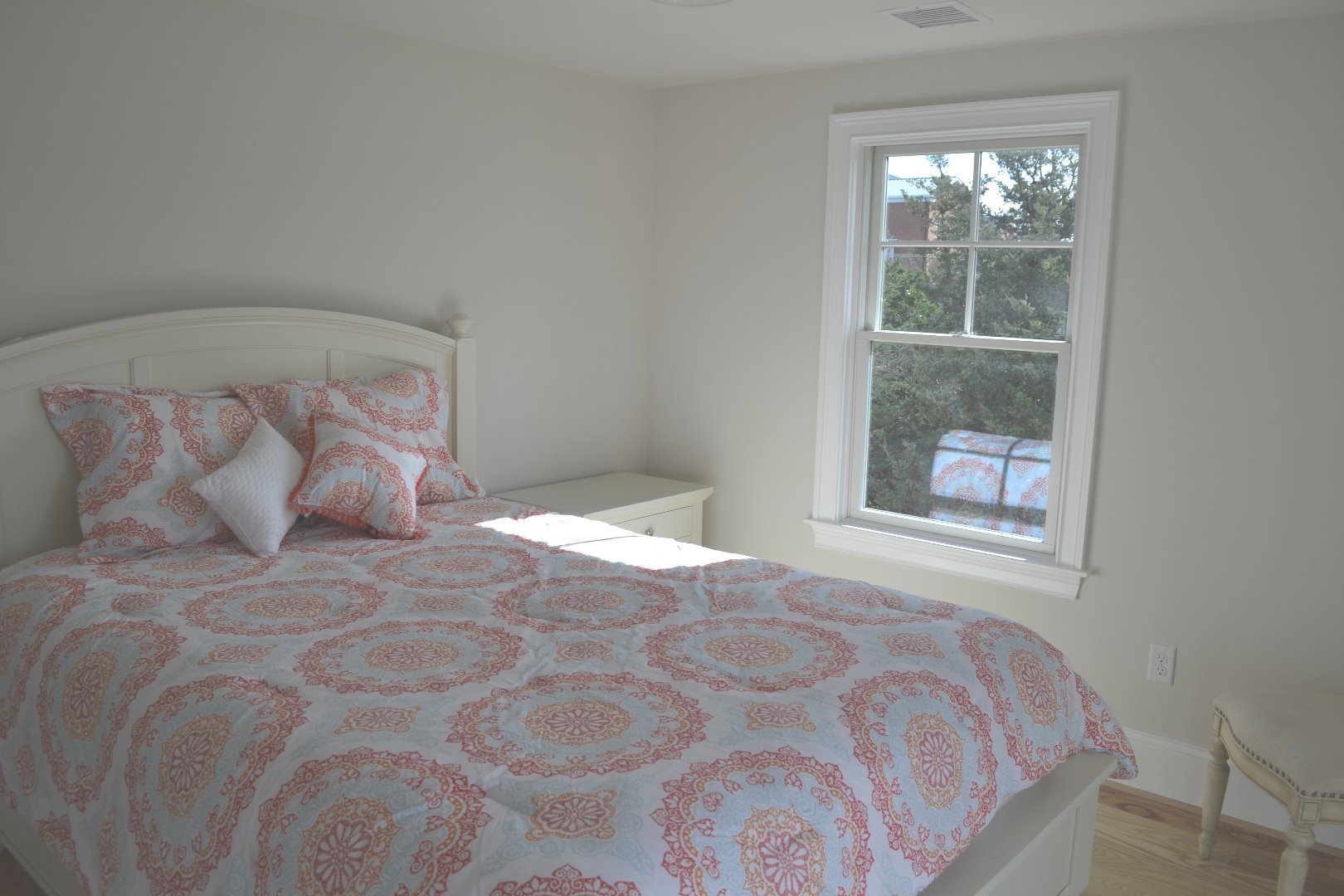 28 Beach Road Oak Bluffs, MA 02557 - Photo 25 of 32 a large bed sitting in a bedroom next to a window