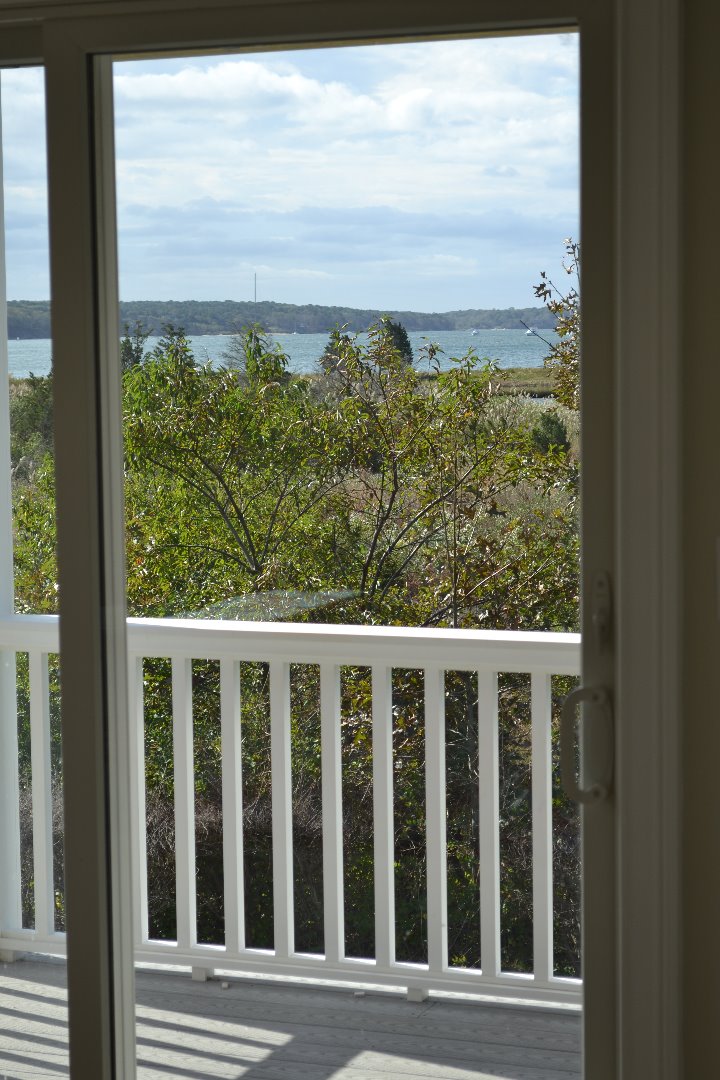 28 Beach Road Oak Bluffs, MA 02557 - Photo 27 of 32 a view of a balcony with an outdoor space