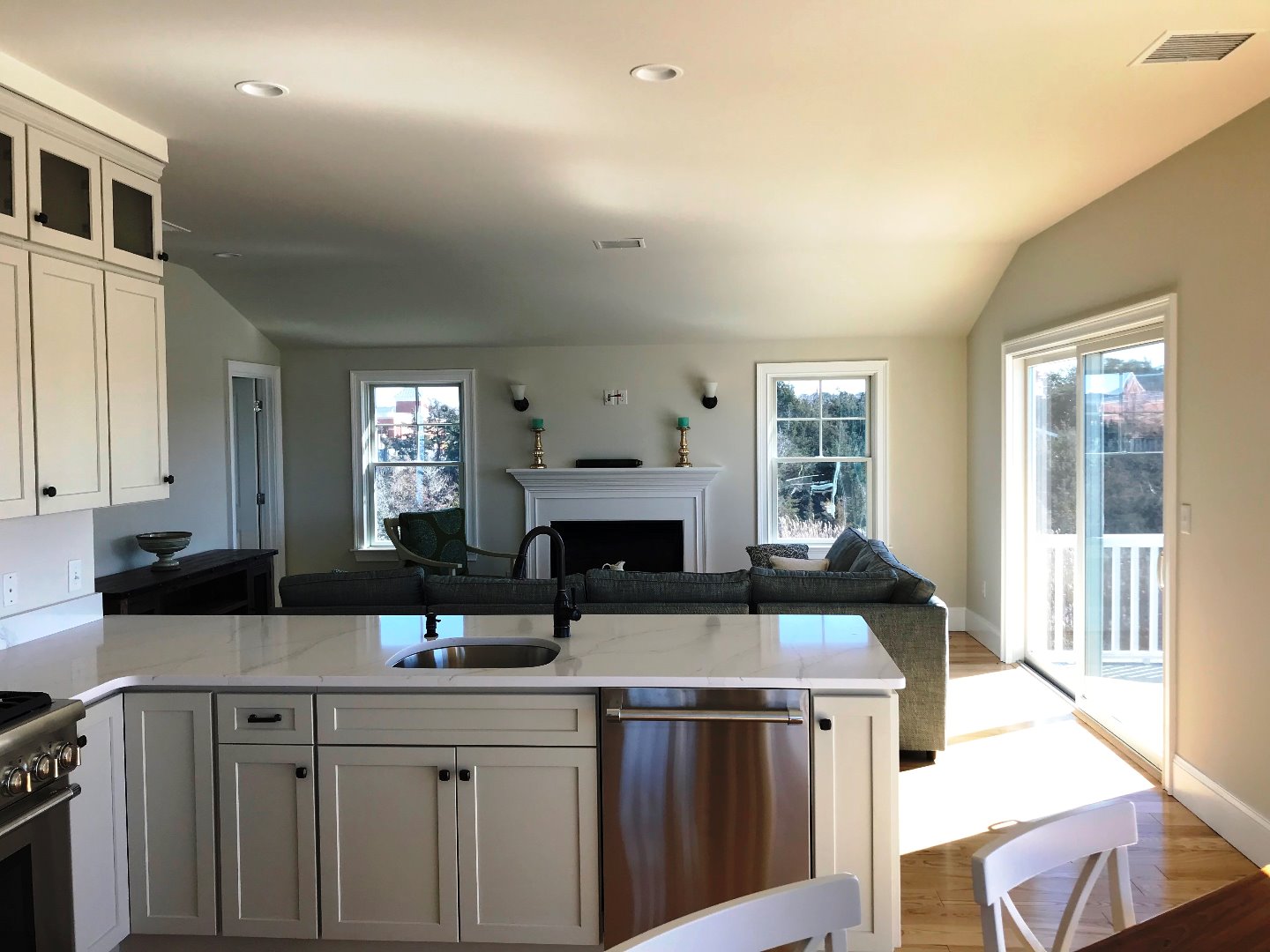 28 Beach Road Oak Bluffs, MA 02557 - Photo 4 of 32 a kitchen with a sink and cabinets