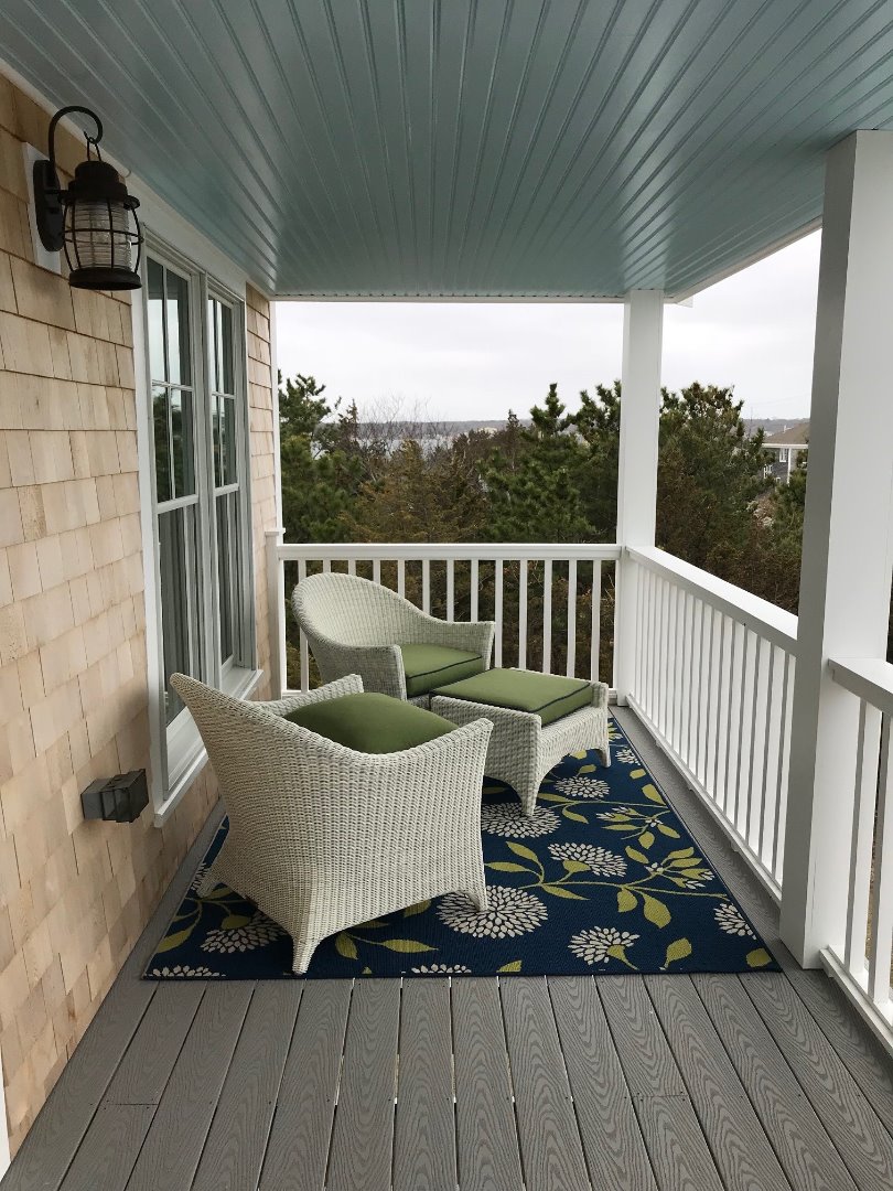 28 Beach Road Oak Bluffs, MA 02557 - Photo 31 of 32 a view of a two chairs in the balcony