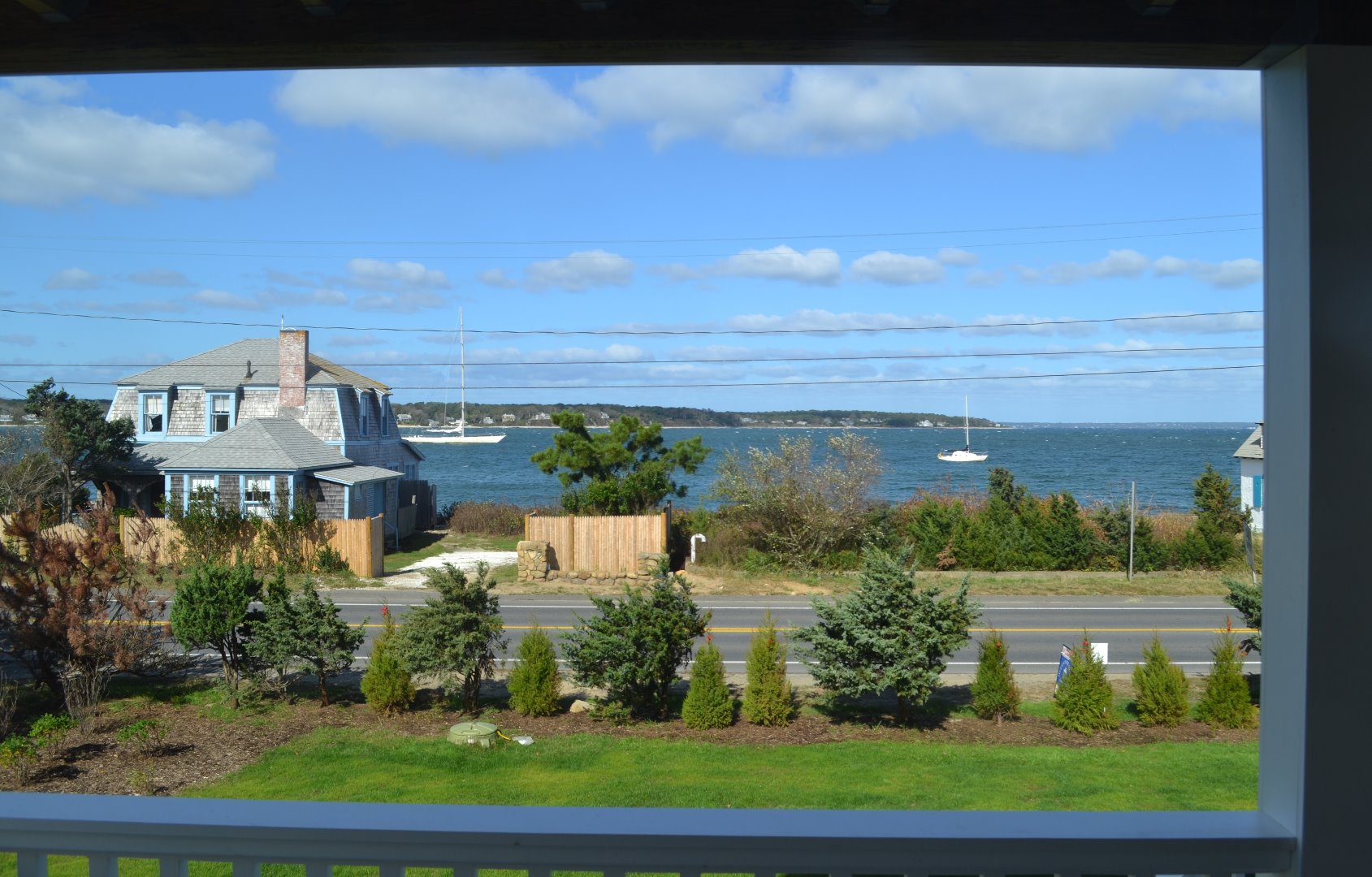28 Beach Road Oak Bluffs, MA 02557 - Photo 32 of 32 a view of a lake with a building in the background