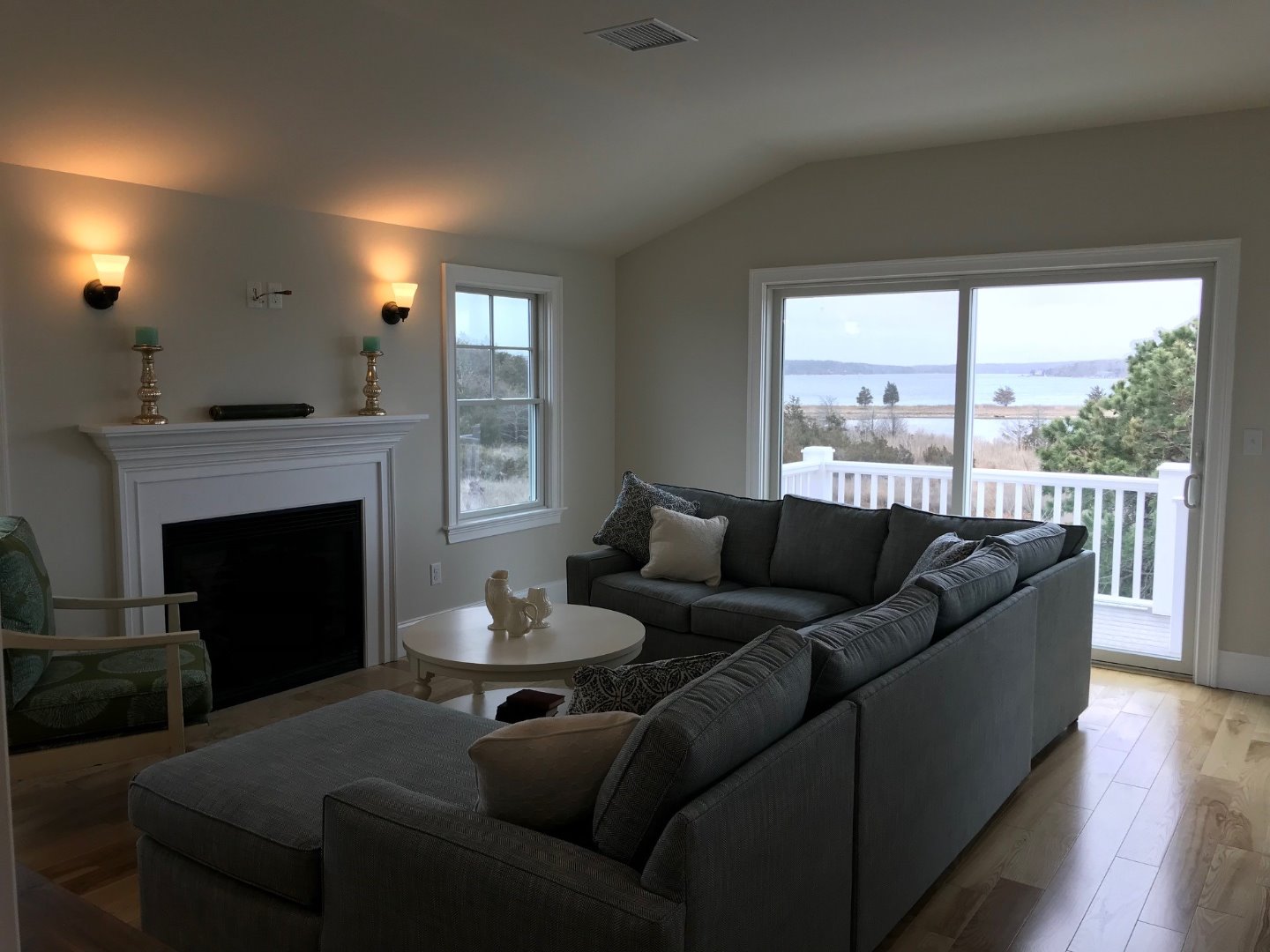 28 Beach Road Oak Bluffs, MA 02557 - Photo 5 of 32 a living room with furniture and a fireplace