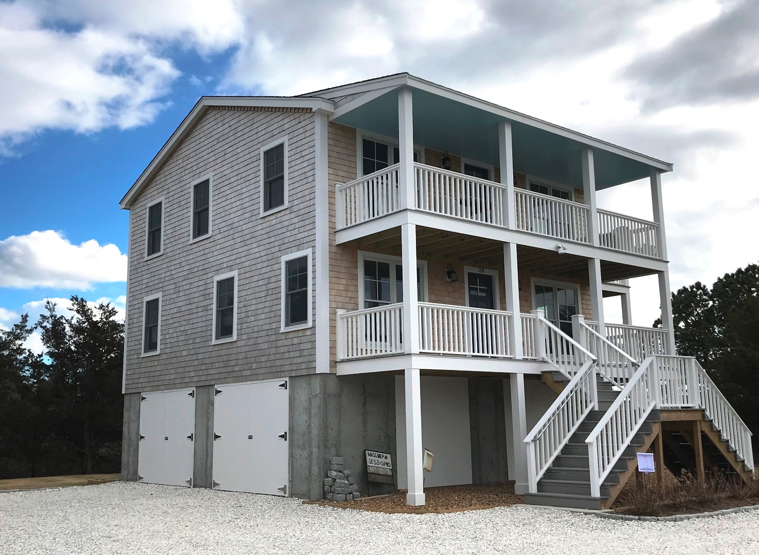 28 Beach Road Oak Bluffs, MA 02557 - Photo 7 of 32 a large building with a large windows