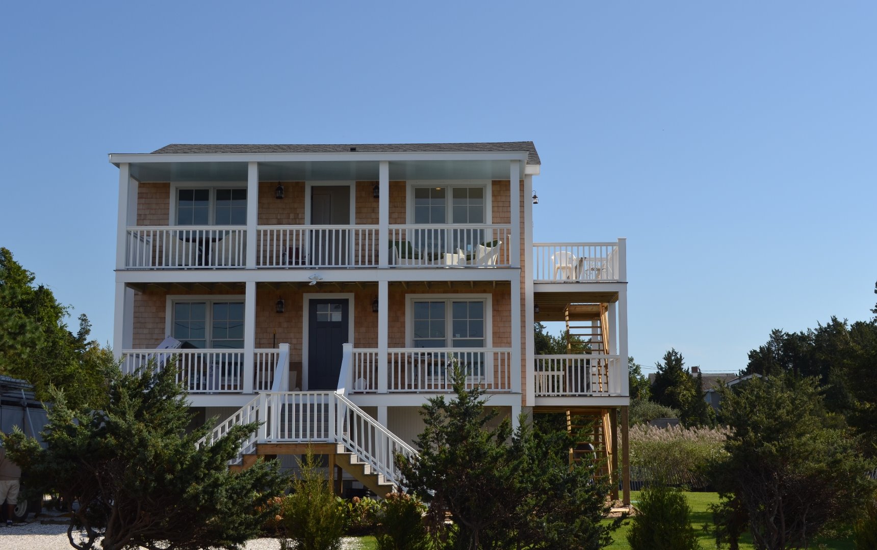 28 Beach Road Oak Bluffs, MA 02557 - Photo 8 of 32 a front view of a house with a yard