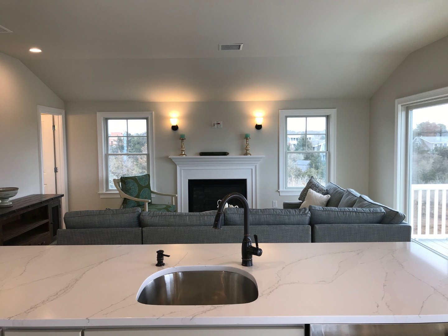 28 Beach Road Oak Bluffs, MA 02557 - Photo 9 of 32 a living room with furniture and a fireplace