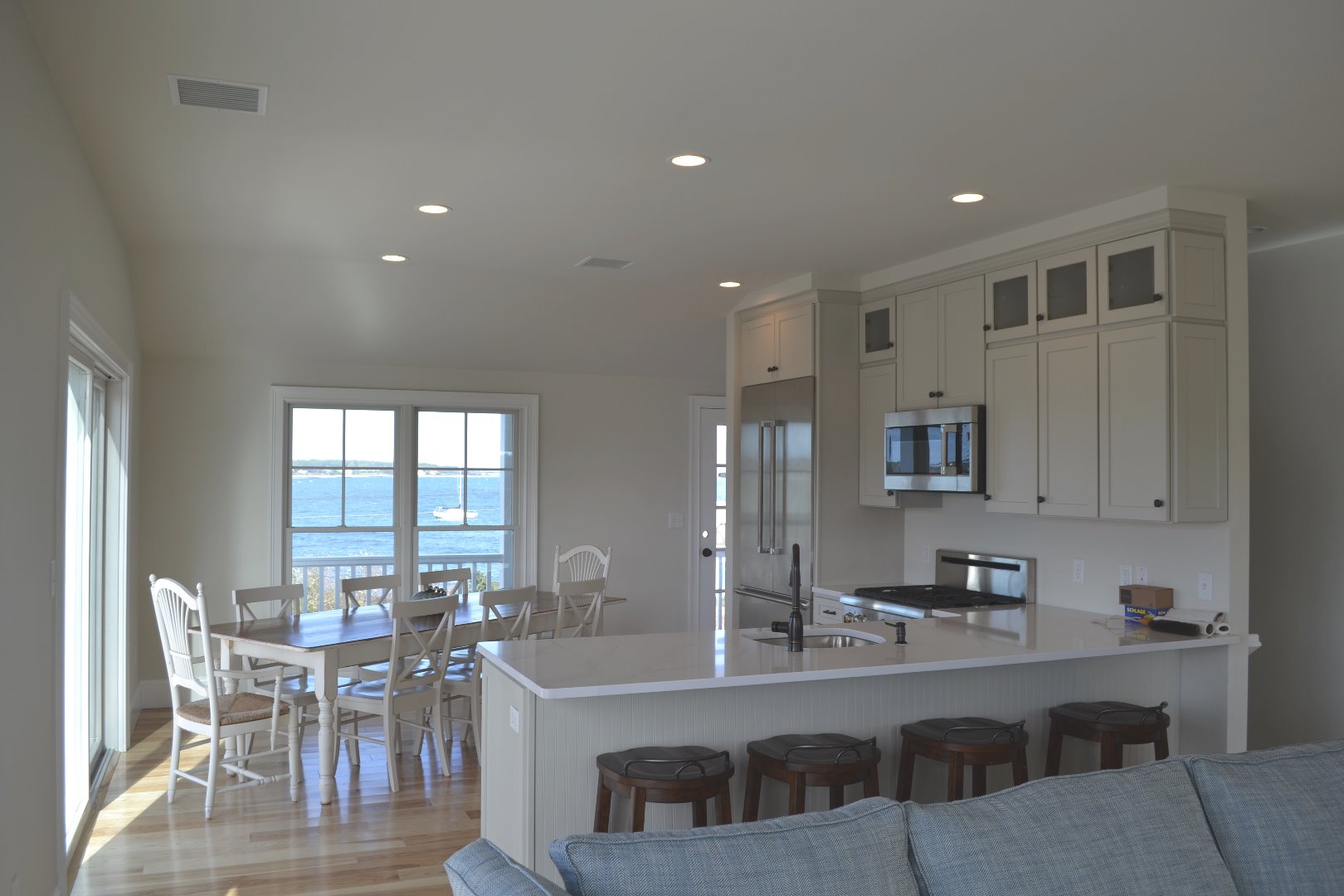 28 Beach Road Oak Bluffs, MA 02557 - Photo 10 of 32 a large kitchen with a table and chairs