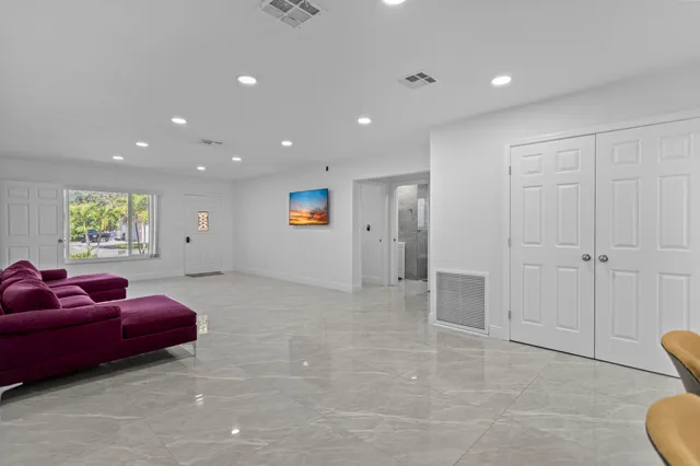 a living room with furniture and a table