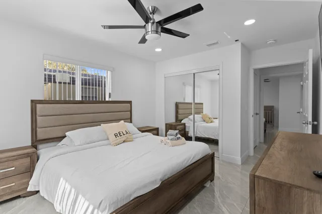 a bedroom with a bed and window