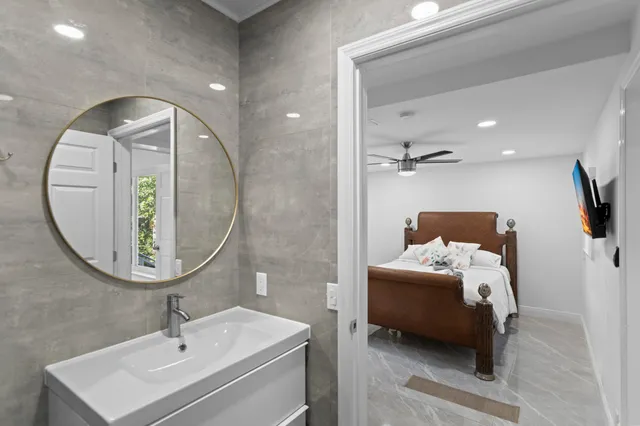 a bathroom with a shower a toilet and a sink