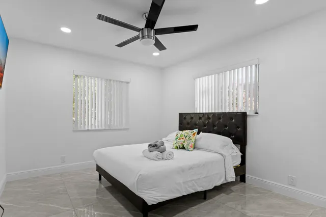 a bedroom with furniture and air hockey table
