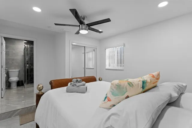 a bedroom with furniture and window