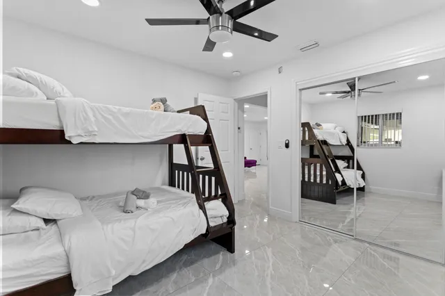 a bedroom with a bed and a table