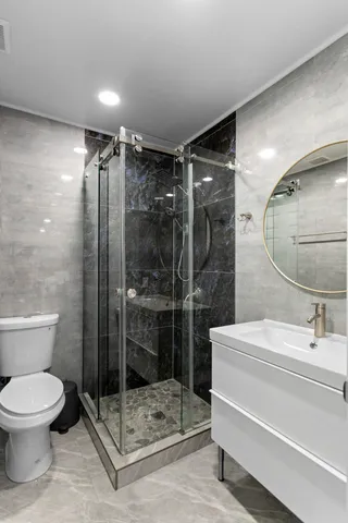 a bathroom with a toilet sink shower and bathtub