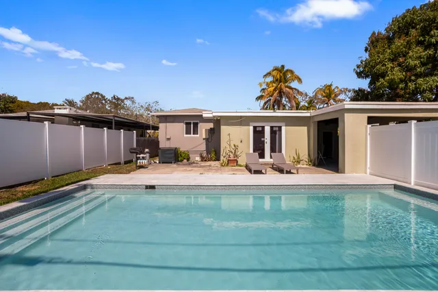 a house view with a backyard space