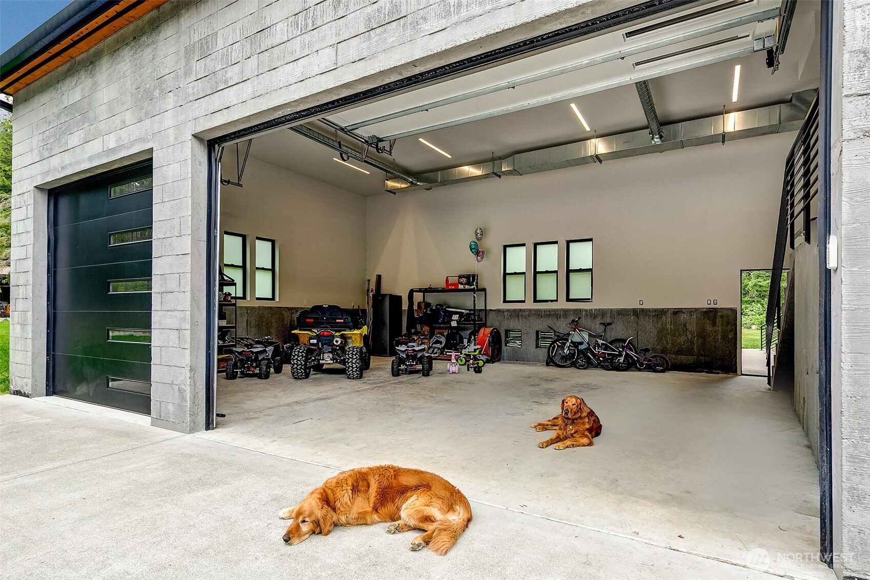 7538 Moon Valley Road Southeast North Bend, WA 98045 - Photo 29 of 40 a view of a garage with parked cars