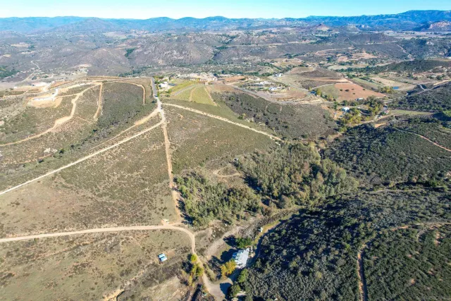 a view of a lake with a house in the background