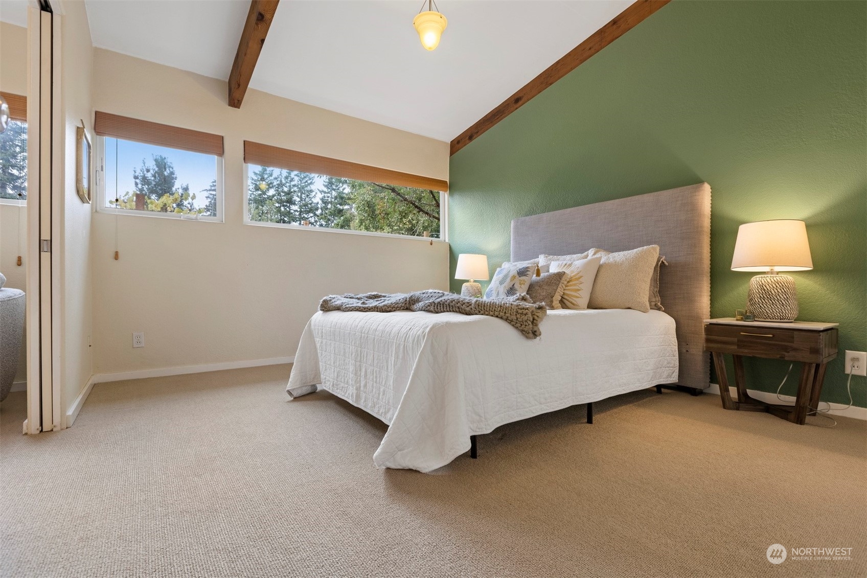 289 Briar Road Bellingham, WA 98225 - Photo 14 of 40 a bedroom with a bed lamp and a potted plant
