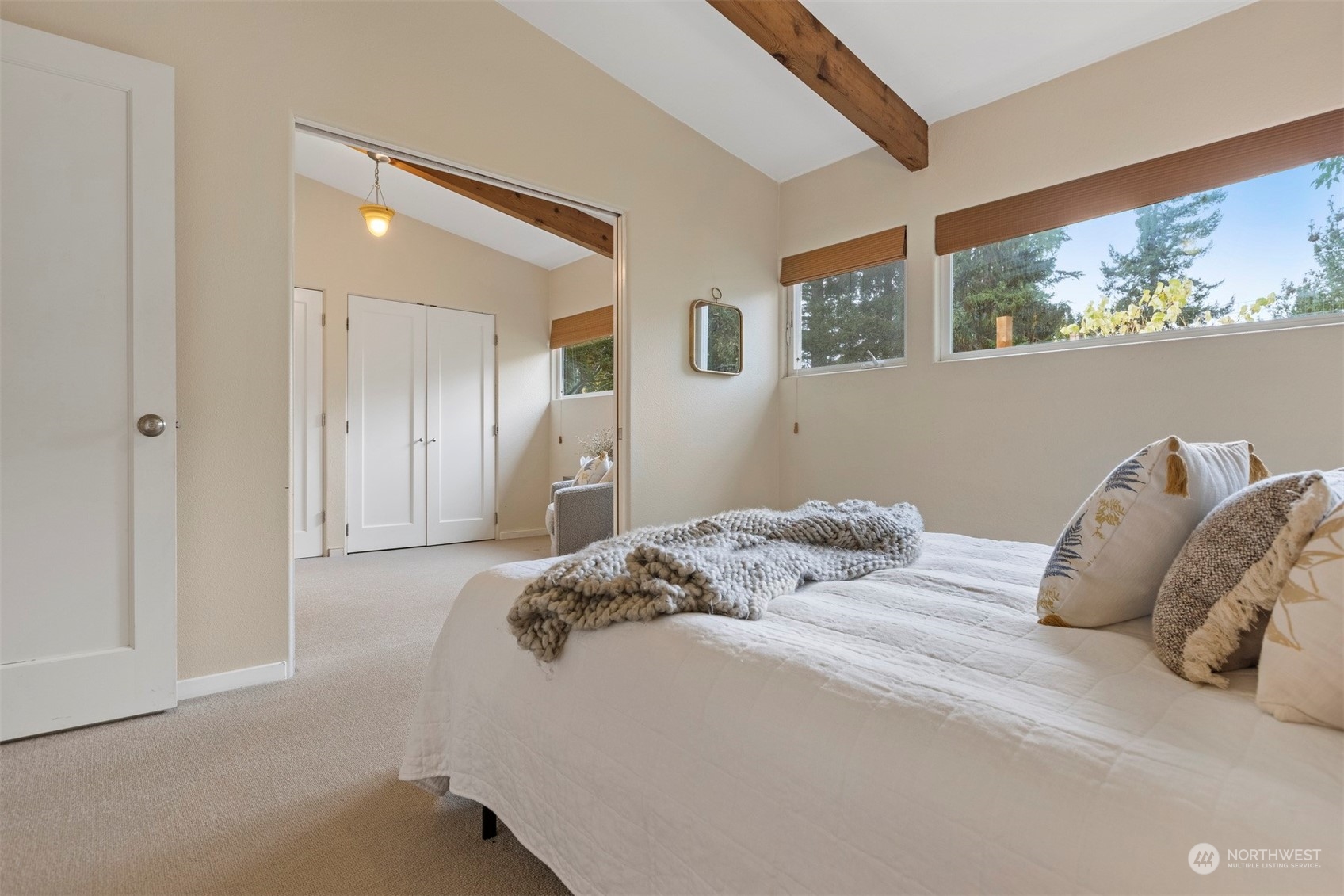 289 Briar Road Bellingham, WA 98225 - Photo 15 of 40 a bedroom with a bed and a painting on the wall