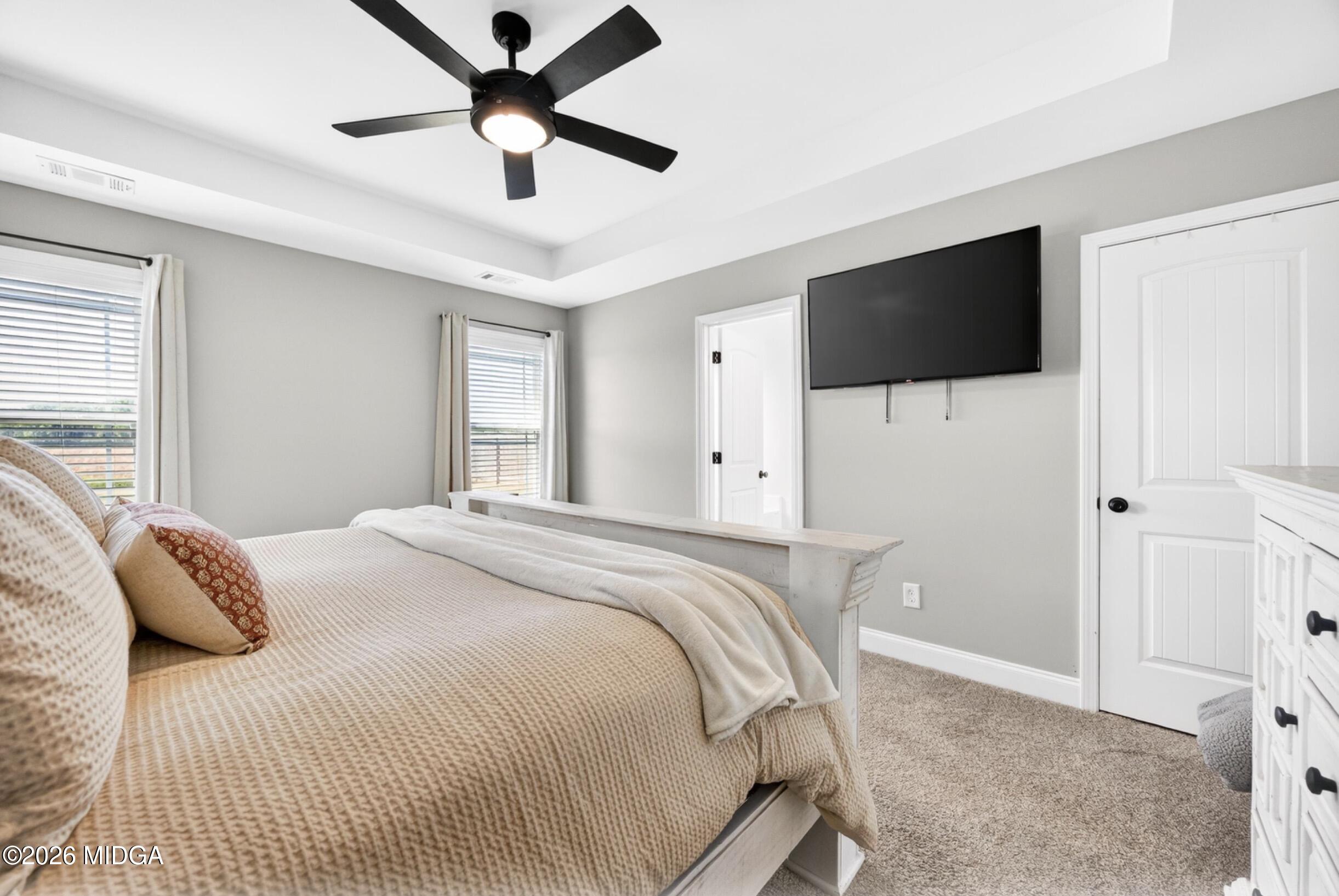 610 Daisy Drive Perry, GA 31069 - Photo 16 of 33 a bedroom with a bed and a flat screen tv