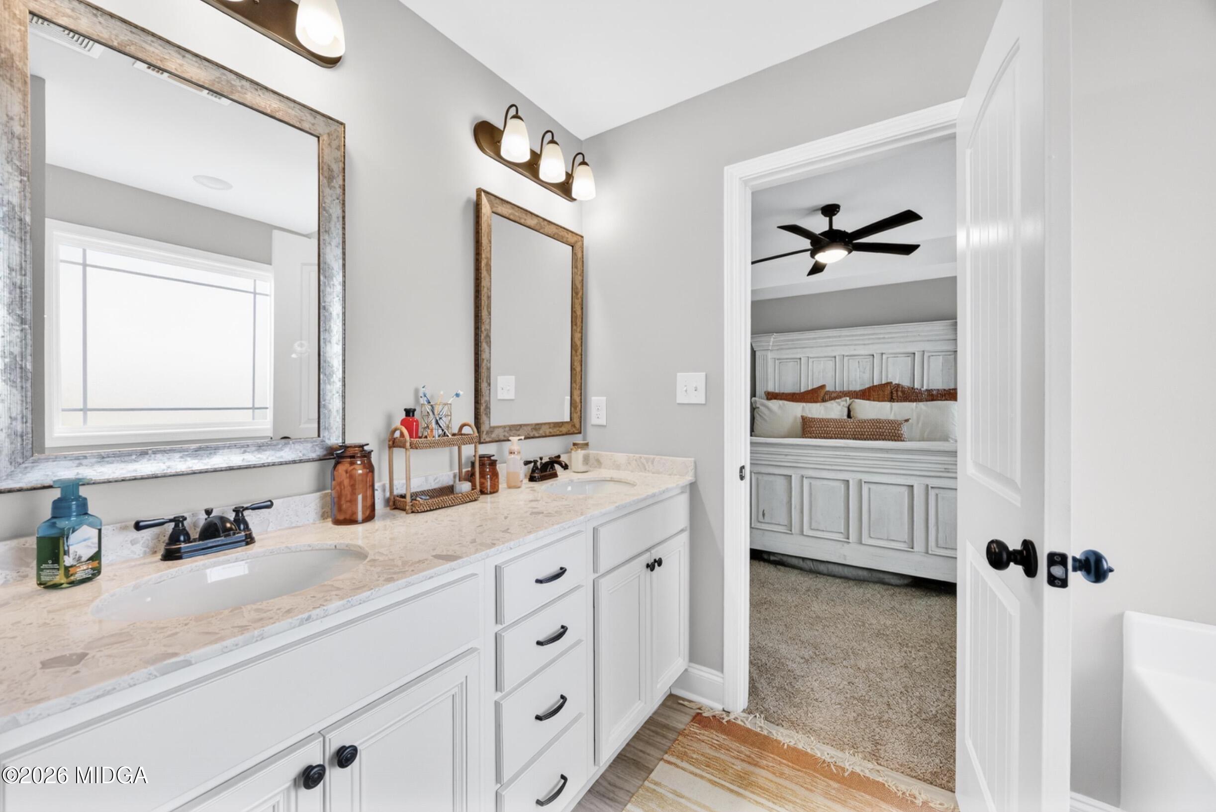 610 Daisy Drive Perry, GA 31069 - Photo 17 of 33 a en suite bathroom with 2 sink and a mirror