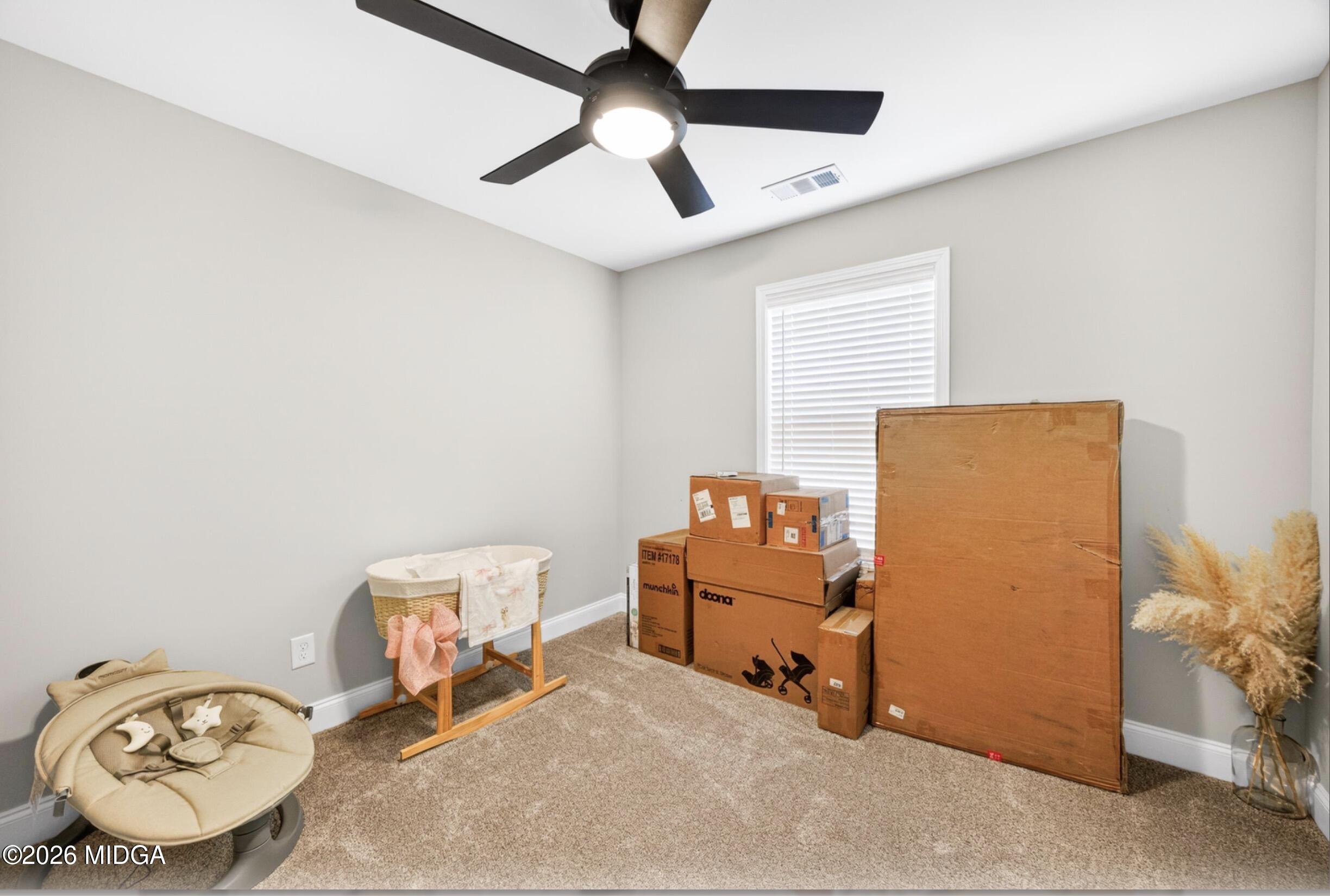 610 Daisy Drive Perry, GA 31069 - Photo 20 of 33 a room with furniture and a fan