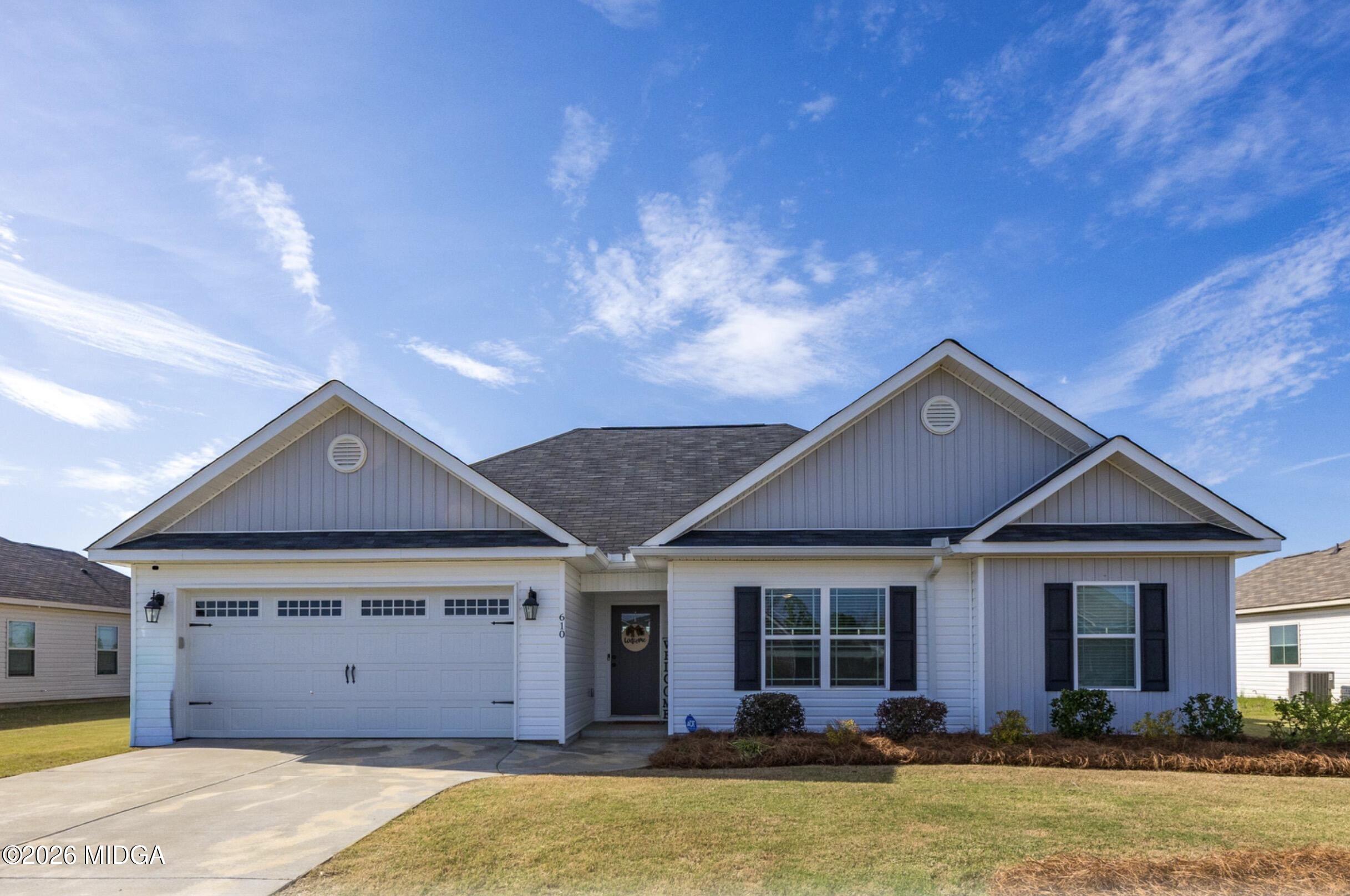 610 Daisy Drive Perry, GA 31069 - Photo 2 of 33 a front view of a house with a yard