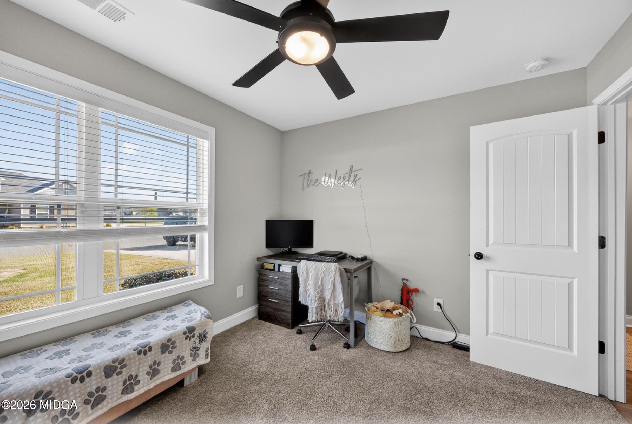610 Daisy Drive Perry, GA 31069 - Photo 24 of 33 a bedroom with furniture and a window