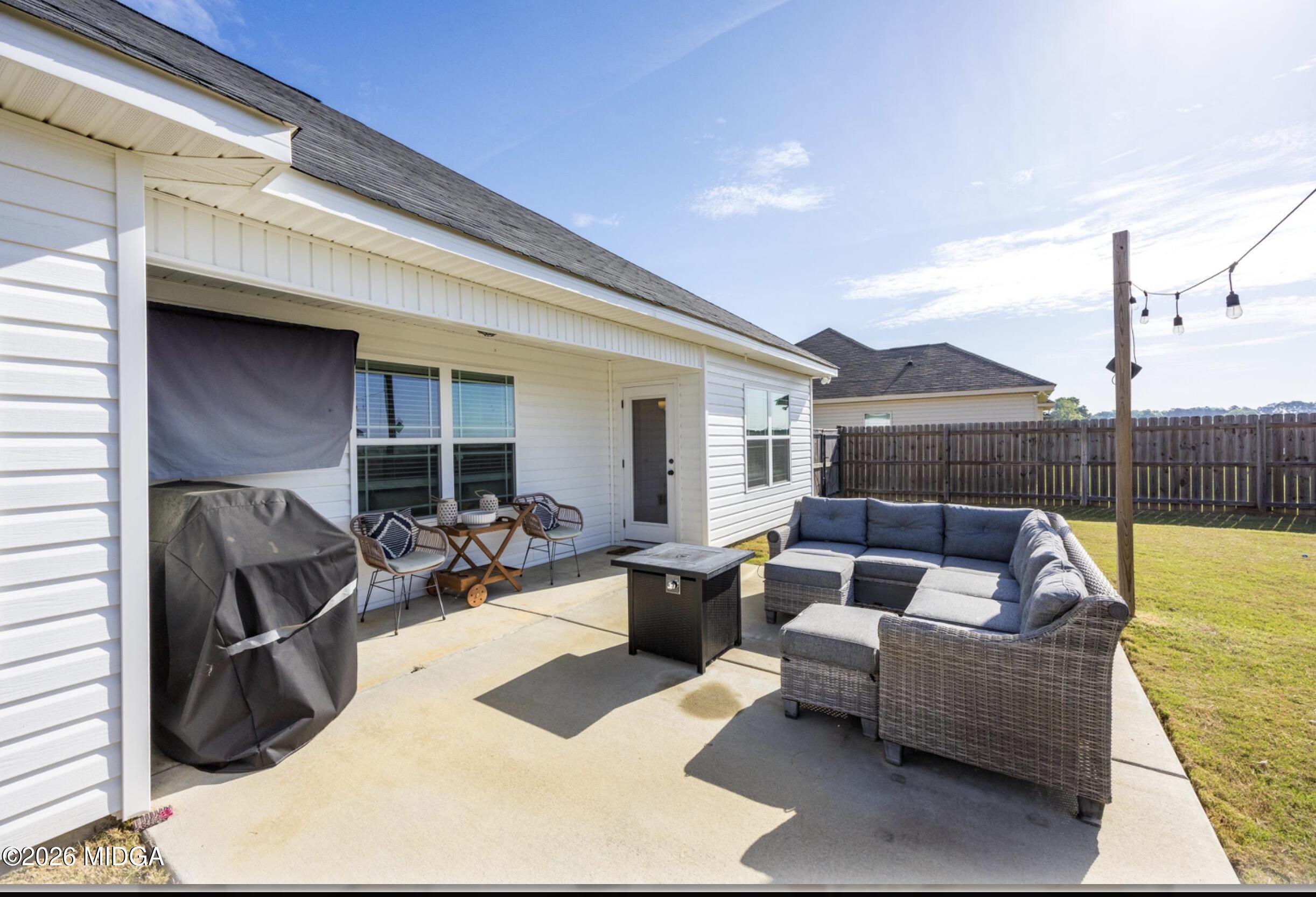 610 Daisy Drive Perry, GA 31069 - Photo 26 of 33 a view of a patio with couches and potted plants