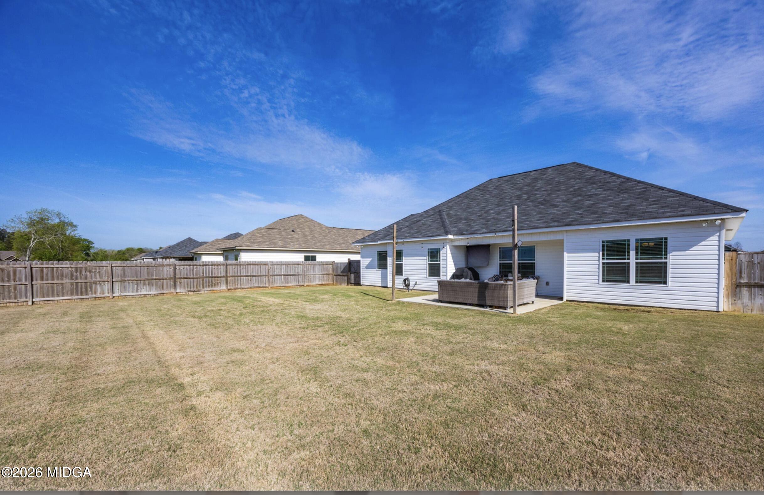 610 Daisy Drive Perry, GA 31069 - Photo 28 of 33 a view of a house with pool and a yard