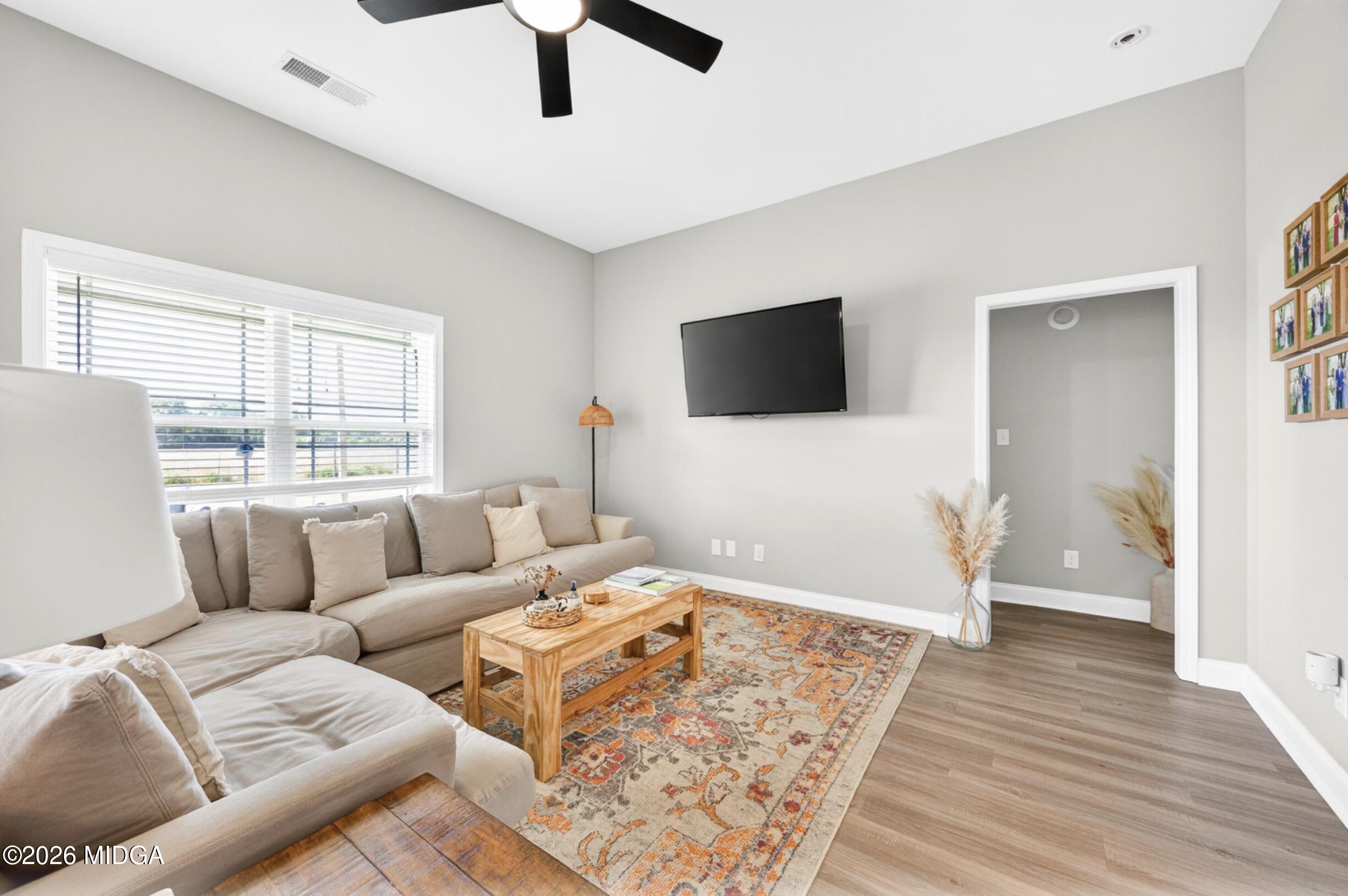 610 Daisy Drive Perry, GA 31069 - Photo 5 of 33 a living room with furniture and a flat screen tv