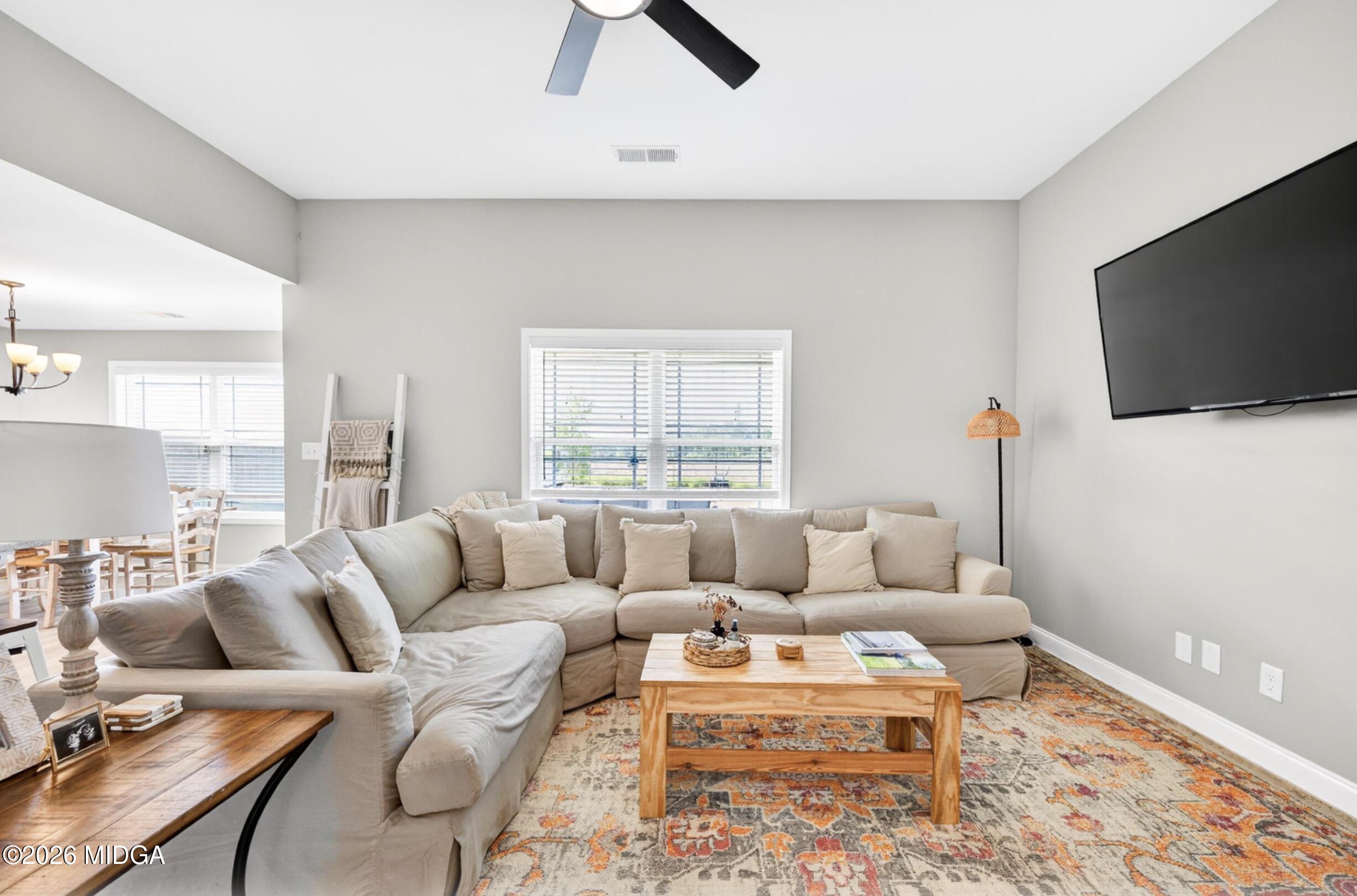 610 Daisy Drive Perry, GA 31069 - Photo 7 of 33 a living room with furniture and a flat screen tv