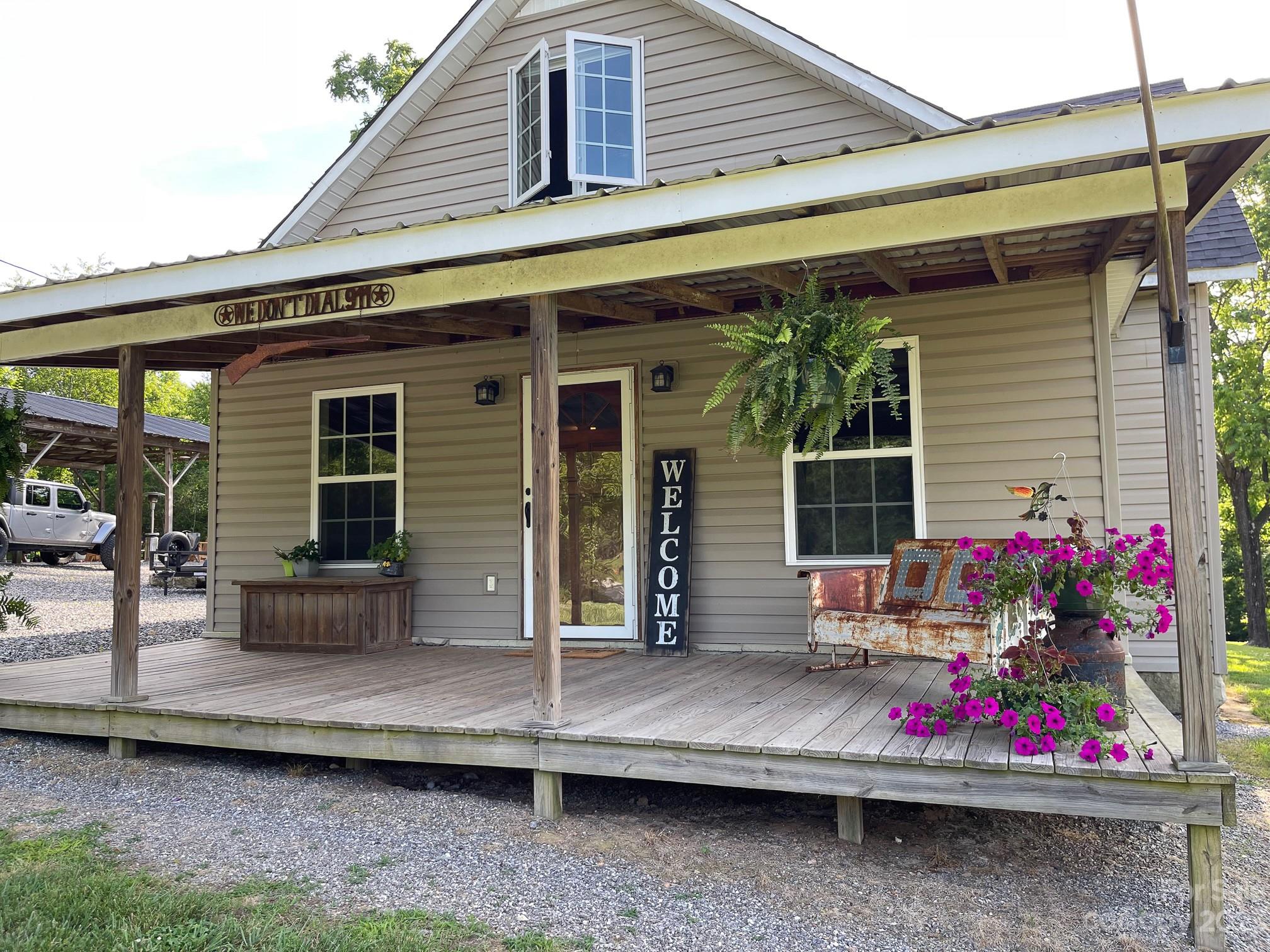 191 Lackey Road Hiddenite, NC 28636 - Photo 2 of 40 a front view of house with outdoor seating