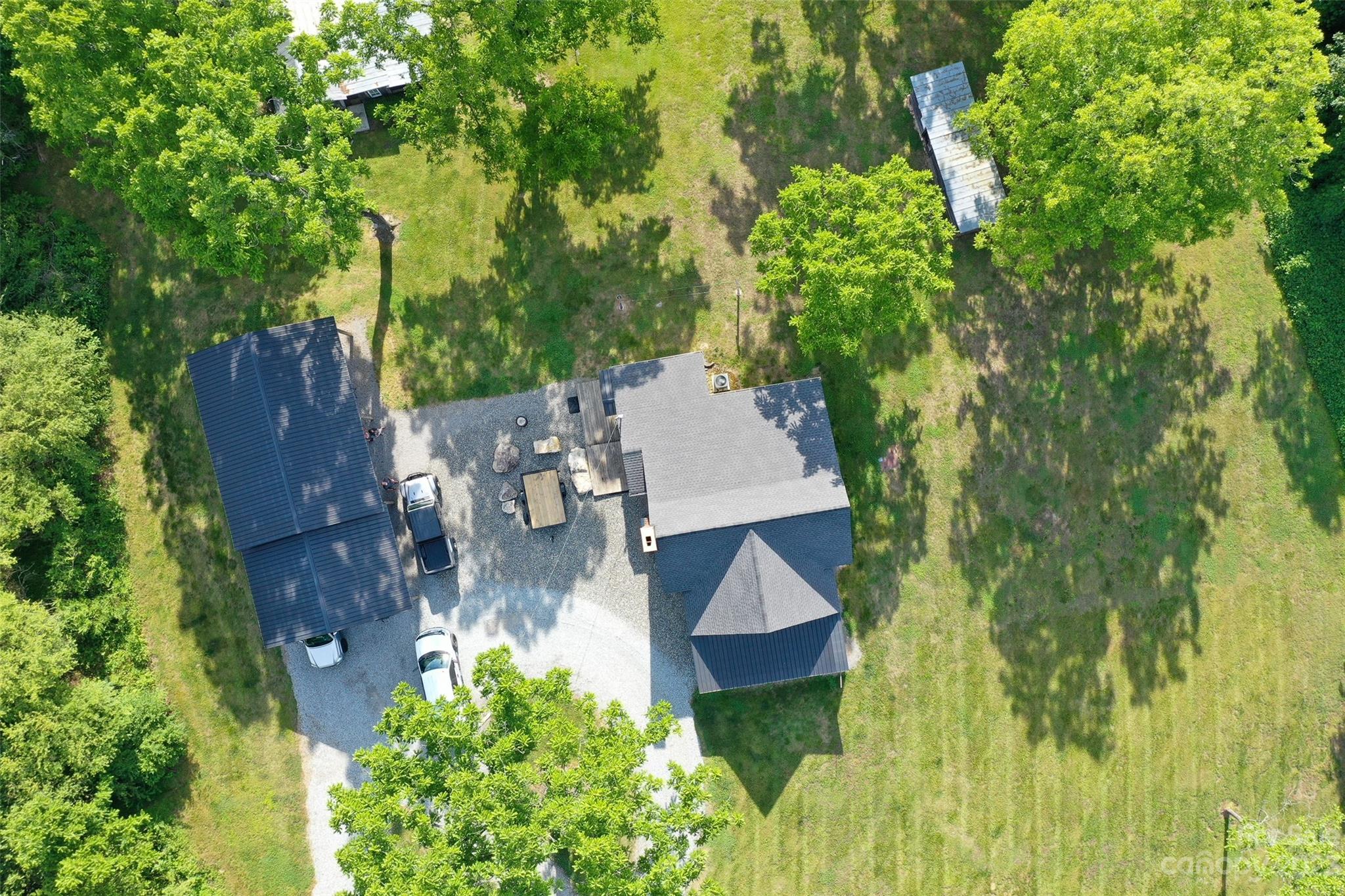 191 Lackey Road Hiddenite, NC 28636 - Photo 33 of 40 an aerial view of residential house with outdoor space and trees all around