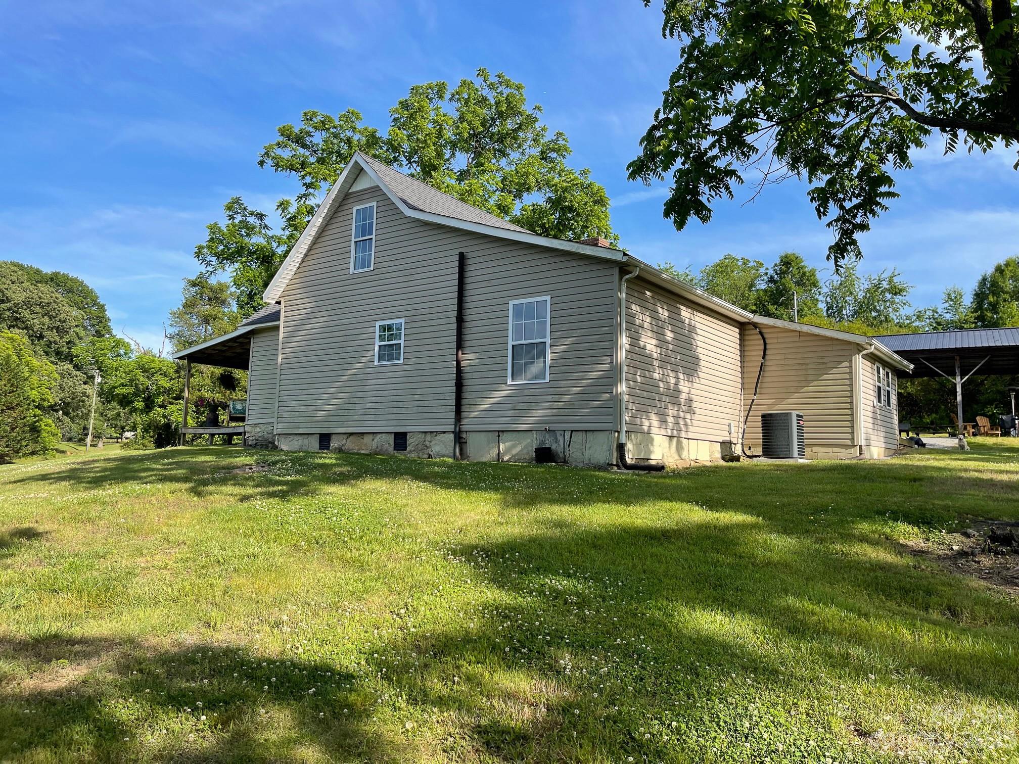 191 Lackey Road Hiddenite, NC 28636 - Photo 4 of 40 a house view with a garden space