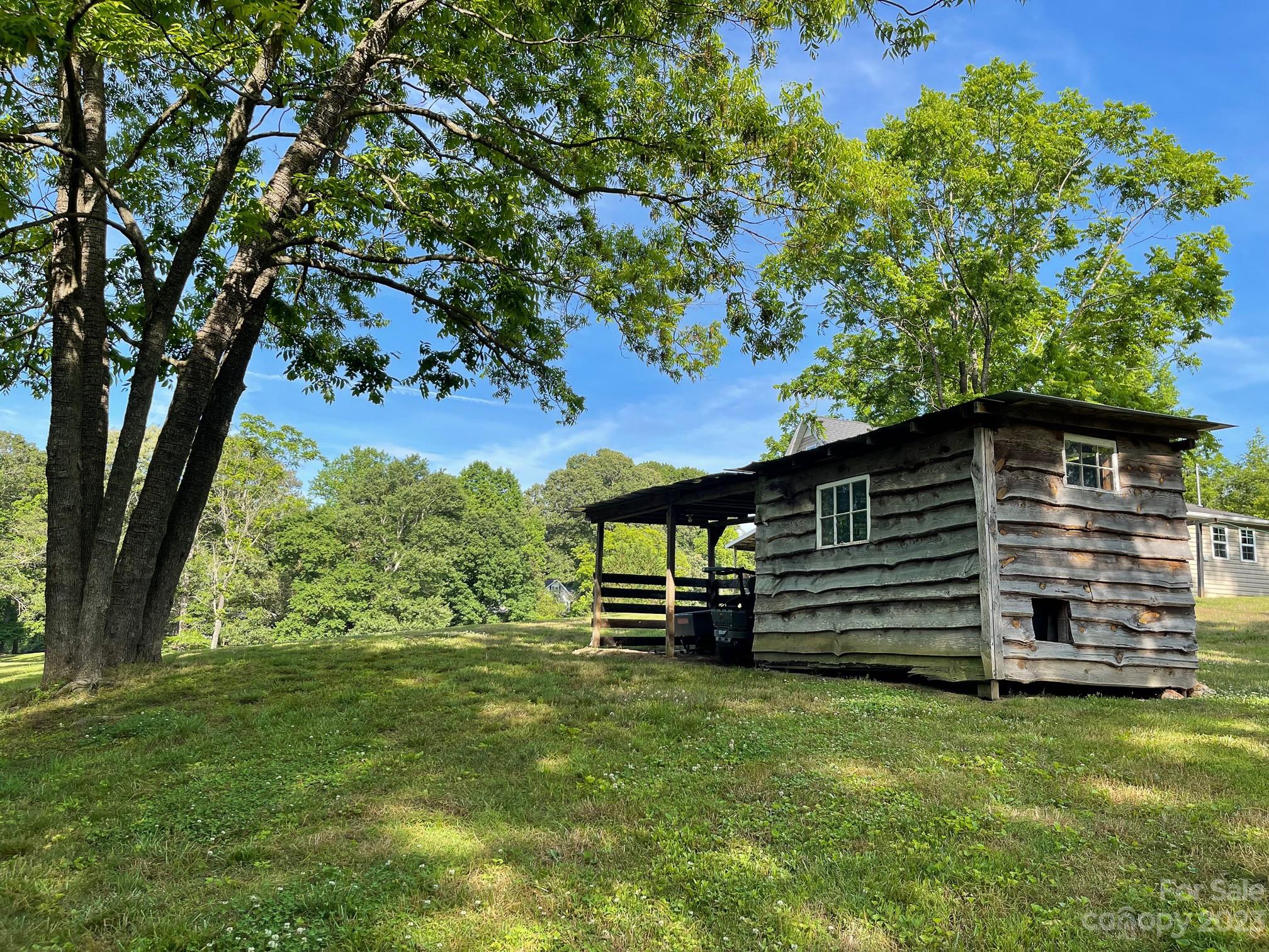 191 Lackey Road Hiddenite, NC 28636 - Photo 8 of 40 a front view of a house with a garden