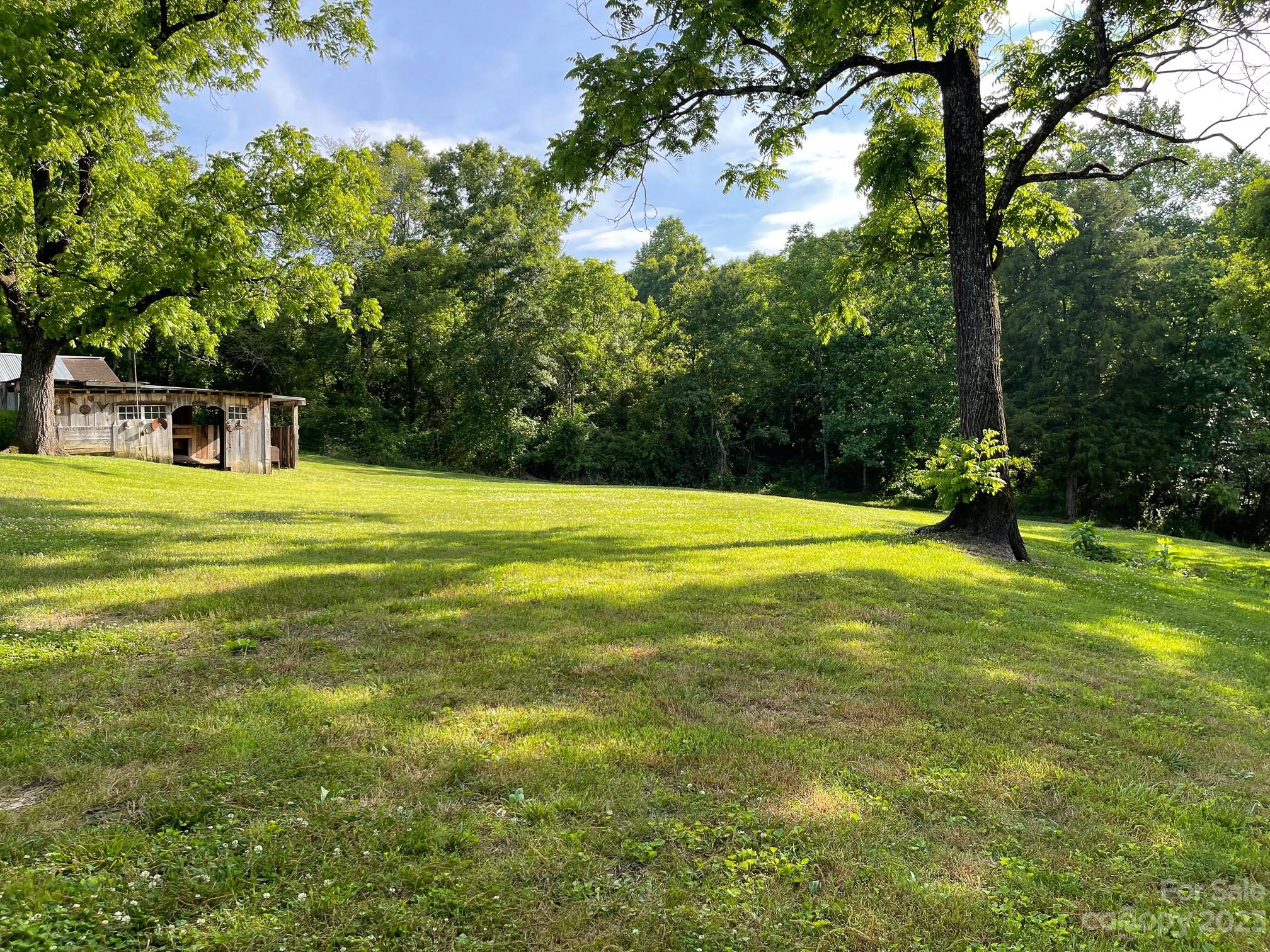 191 Lackey Road Hiddenite, NC 28636 - Photo 10 of 40 a view of a swimming pool with a yard
