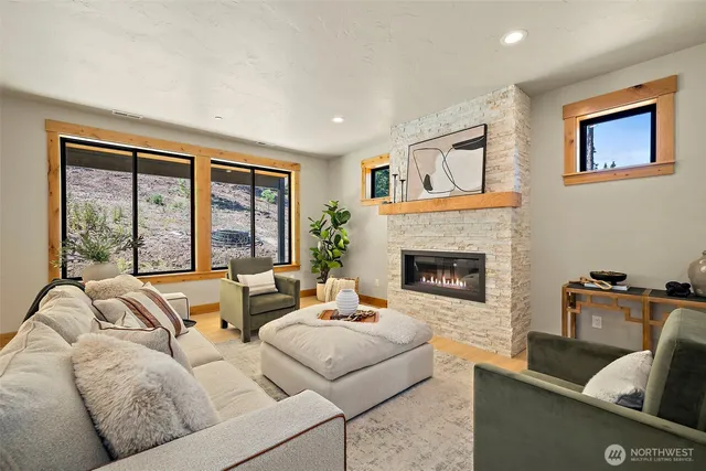 a living room with furniture and a large window