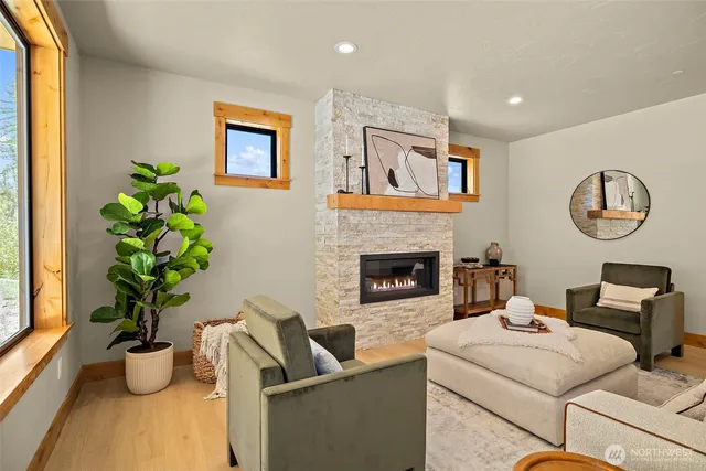 a kitchen with stainless steel appliances granite countertop a stove a sink a oven a dining table and chairs