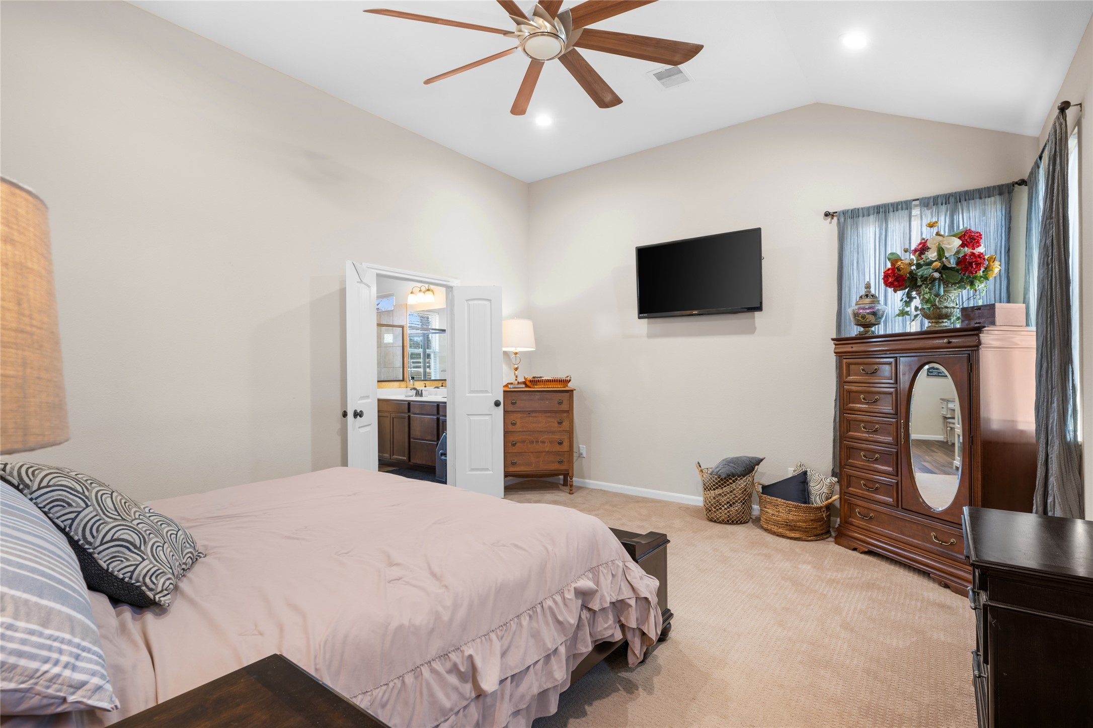 9467 Loop Road Bellville, TX 77418 - Photo 13 of 26 a bedroom with a bed and a flat screen tv