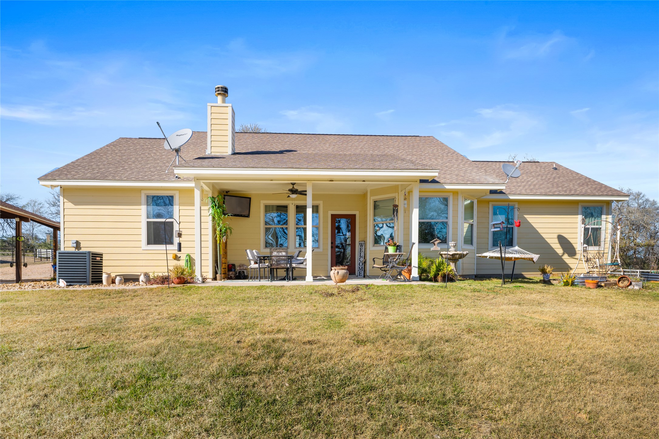9467 Loop Road Bellville, TX 77418 - Photo 22 of 26 front view of a house with a patio