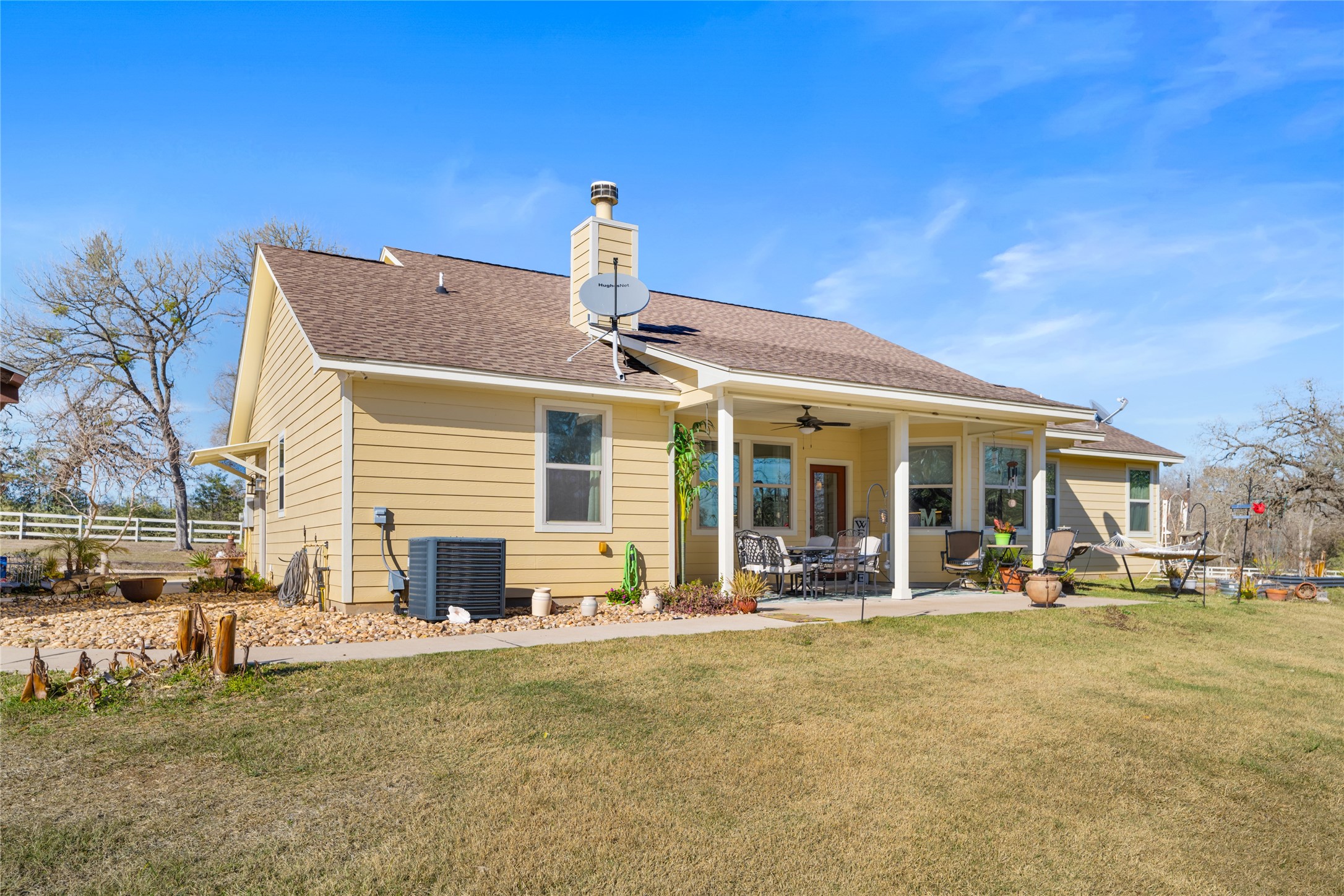 9467 Loop Road Bellville, TX 77418 - Photo 23 of 26 a front view of a building with sitting area
