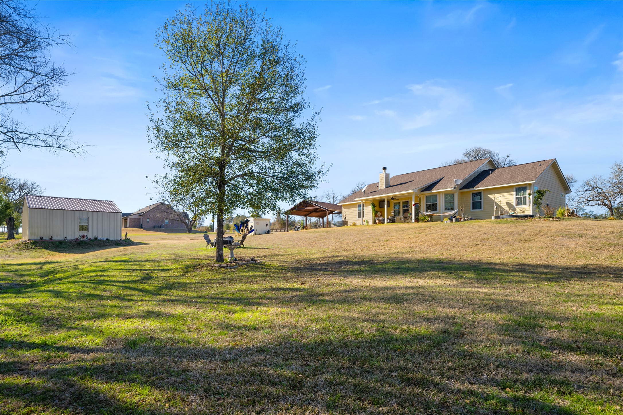 9467 Loop Road Bellville, TX 77418 - Photo 24 of 26 a house view with swimming pool in front of it